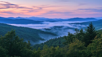Serene Mountain Landscape with Fog and Colorful Sunrise Sky
