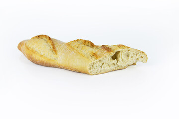 Closeup of a sliced French baguette with a crispy crust and airy texture isolated on a white background. With clipping path. Copy space..