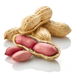 Several peanuts are arranged on a white background.&nbsp; Some peanuts are whole in their shells, a light beige color with a slightly rough texture.&nbsp; Other peanuts are split open, revealing a light pinkish