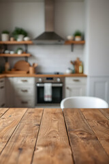 Empty wooden table top with blurred kitchen room interior background. Space for product display and montage.