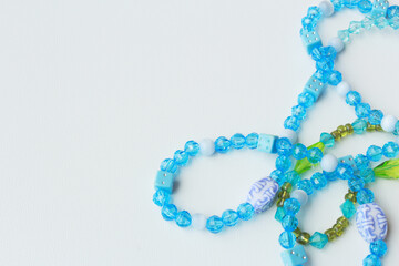 Horizontal abstract background with copy space, featuring vibrant green and blue acrylic bead...