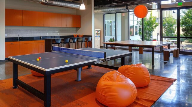 office break area with ping pong tables, bean bags, and modern decor