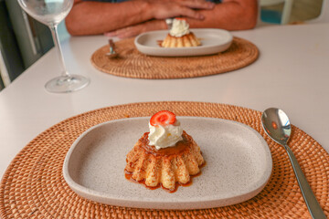 caramel custard pudding on table for two