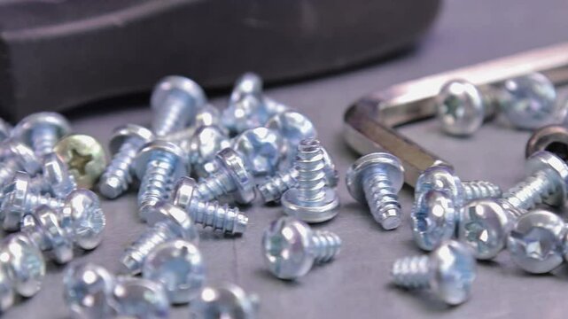 Metal screws for fastening equipment. Soft focus. Close-up. 