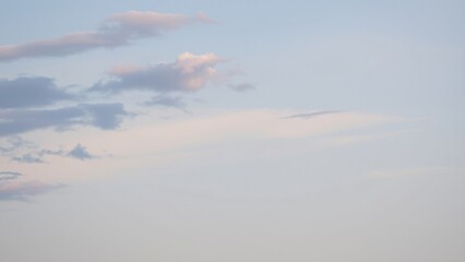 Serene Pastel Sky with Wispy Clouds at Dawn or Dusk