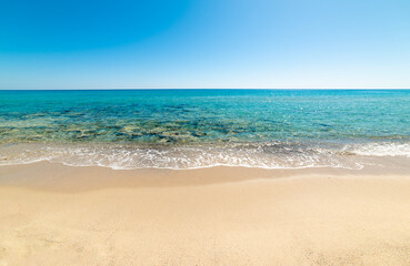 White sand and turquoise water in an empty beach