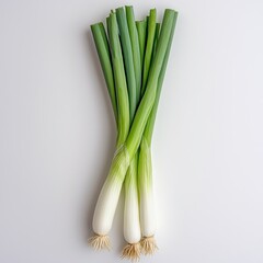 Fototapeta premium Fresh green onions arranged neatly, showcasing their vibrant green tops and white roots, perfect for garnishing and adding flavor to dishes.