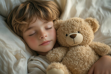 Newborn child in co-sleeper crib sleeping with his bear toy