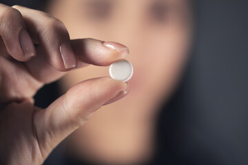 woman taking medicine pill
