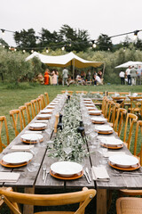 Rustic Wedding Table Decor with Greenery and Elegant Tableware in Tuscany