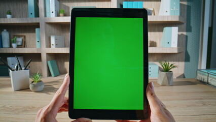 Ceo browsing report green screen tablet at office closeup. Unrecognizable woman