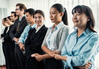 Modern diversity and multicultural company, business people joining hand together and standing in line, shared commitment to collaboration and cooperation concept background. Meticulous