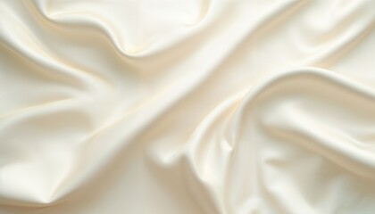 Fototapeta premium Luxurious smooth ivory silk fabric with elegant folds and soft waves, high-quality satin textile background for fashion, wedding dresses, and interior design. Abstract draped cloth texture with gentle