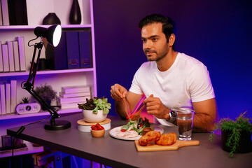 Healthy influencer in host channel tasting chicken meat ingredient health on diet life in mixed salad for easy cooking product by self with tasty food on social media live on meal time. Surmise.