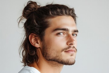 Fototapeta premium Fashionable model showcasing modern men's hairstyle and grooming, exuding confidence and style