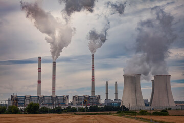 Industrial power plant with smokestack
