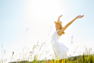 Fashion, freedom and portrait of woman outdoor for biodegradable, organic or sustainable clothing. Green, hands raised and zero waste with happy person in countryside or nature for cruelty free style © peopleimages.com