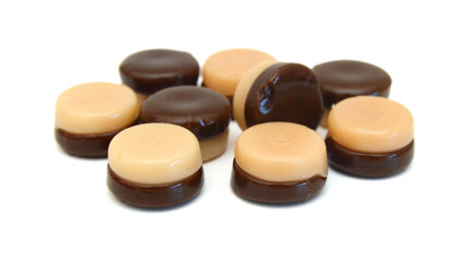 Caramel candies isolated on white background