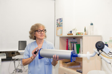 Female medical professional conducting spirometry test