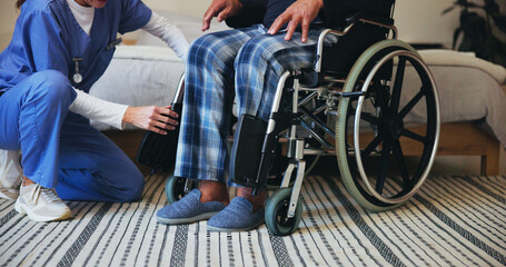Obraz premium Hands, caregiver or shoes with wheelchair for support, elderly care or assisted living at retirement or old age home. Closeup, nurse or volunteer helping person with a disability for mobility or walk