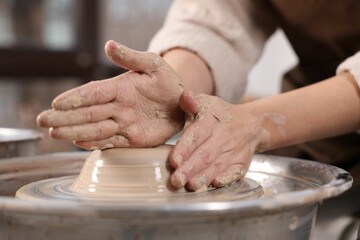 Hobby and craft. Woman making pottery indoors, closeup