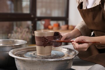 Hobby and craft. Woman making pottery indoors, closeup