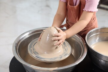 Hobby and craft. Girl making pottery indoors, closeup