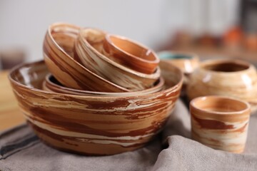 Different beautiful pottery on table indoors, closeup