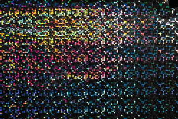 detail macro photo of silver rainbow holographic dot foil material, colorful hologram surface, glitter pixel pattern background.