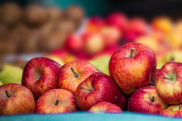 A vibrant pile of red and yellow apples at a farmers market. Fresh, juicy fruit ready for sale. Perfect for healthy eating, autumn themes, and food blogs