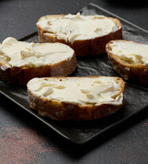 Cream cheese spread on ciabatta pieces, appetizer