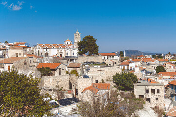 Pano lefkara village in cyprus showing church of the holy cross with stone houses and mountains in background. Larnaka District