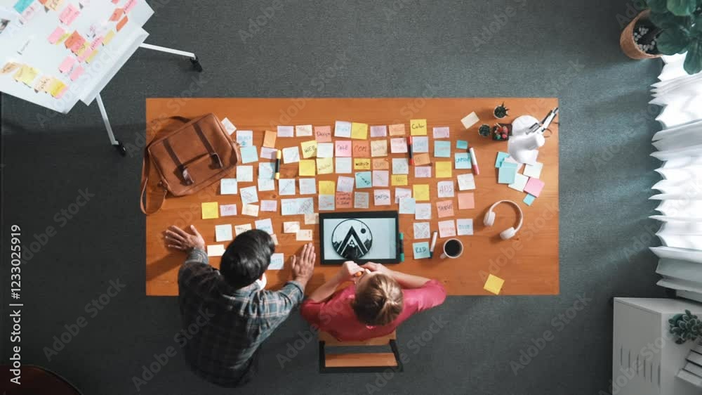Poster top view of manager writing idea on sticky notes and explain idea about web design. professional mar