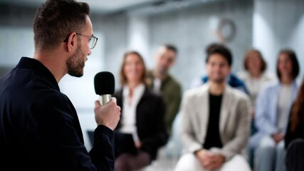 Speaker At Conference Having Speech With Microphone. Debate At Event