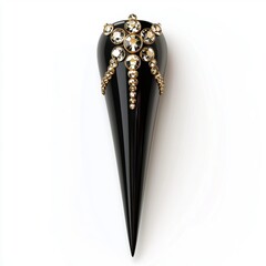 Obraz premium Glossy black stiletto nails with gold accents and rhinestones, placed on a bright white background