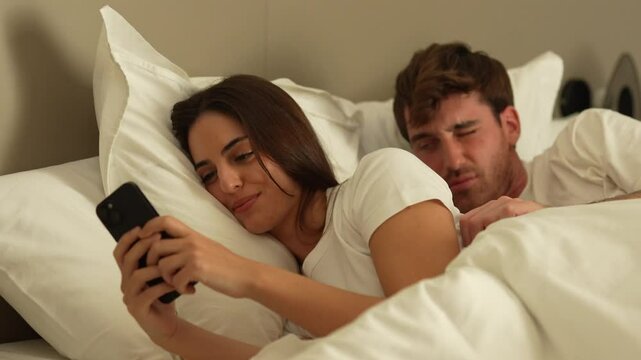 Young man and woman at home using smartphone and laptop, in moments of daily life, connection, emotions, love, conflict, technology and modern lifestyle