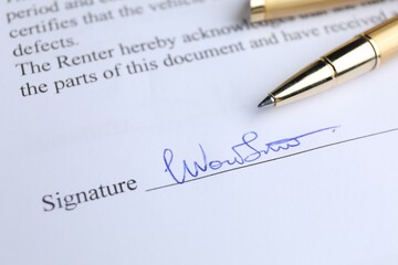 Ballpoint pen and signature on contract, closeup