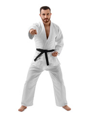 Man in uniform practicing karate on white background