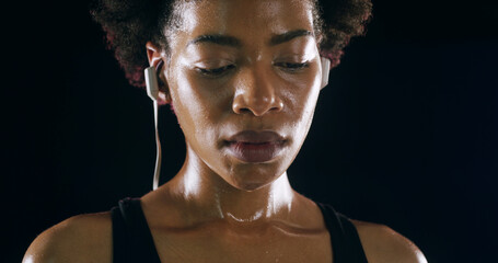 Earphones, fitness and black woman rest in studio for intense training, exercise and workout....