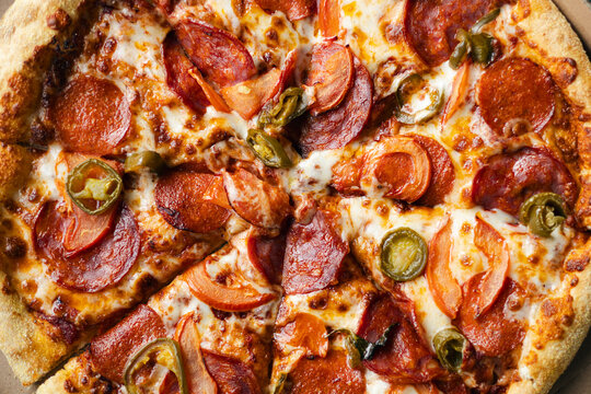 Closeup of a freshly baked spicy pepperoni pizza