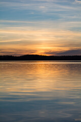 Obraz premium A scenic lake view in the forests of Finland in spring time