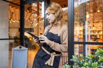 Worker using a tablet in a cosmetics store setting