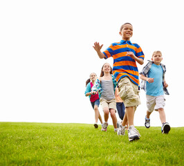 Playing, running and group of kids on grass for outdoor games, race and happy development space....