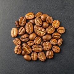 Naklejka premium Close-Up of Roasted Coffee Beans Arranged in a Circular Pattern on a Dark Slate Background for Food and Beverage Photography