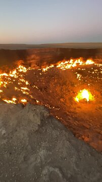 The shining of Karakum: Evening video of the blazing Darvaza gas crater known as the Door to Hell in the desert, Turkmenistan