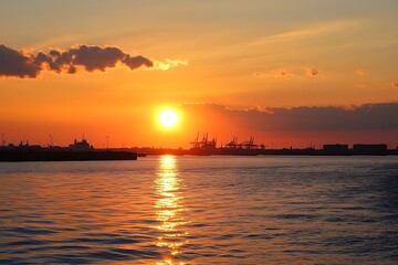 Naklejka premium As the sun set over the old port of Copenhagen, tourists on a holiday cruise boat tour enjoyed a stunning panoramic view of the city's historic landmarks.