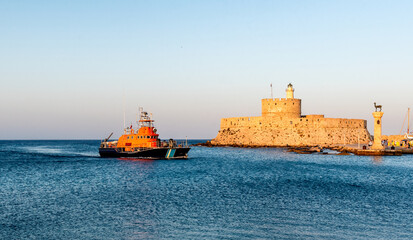 Coast Guard ship in Mandraki port in Rhodes town, Greece