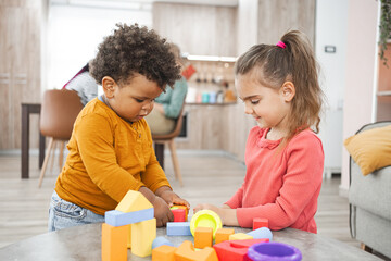 Naklejka premium Multiracial family spending quality time together indoors on a weekend