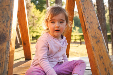 Little girl crying on the playground in the playground