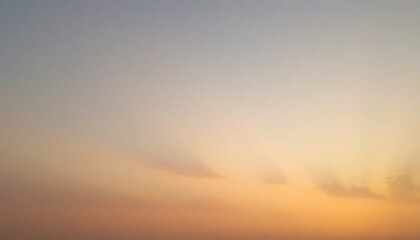 Fototapeta premium Soft Hues Of Sunset Sky With Subtle Clouds